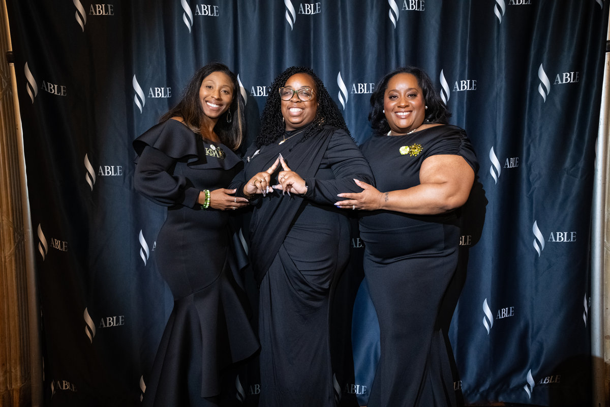 Three guests together at the ABLE Legacy Gala
