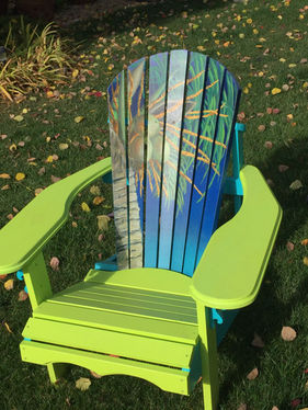 Palm tree motif painted on wood Adirondack chair.