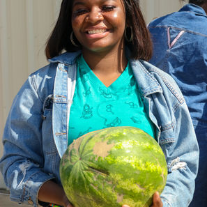 Youth World (July 24, 2021D). A smiling young woman happy to have something yummy to eat.