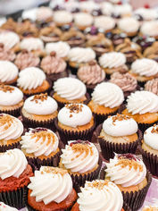rows of cupcakes at Cupcaked Bakery.JPG