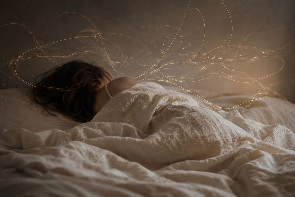 Woman sleeping in cream bed, wrinkled sheets, energy strands swirling