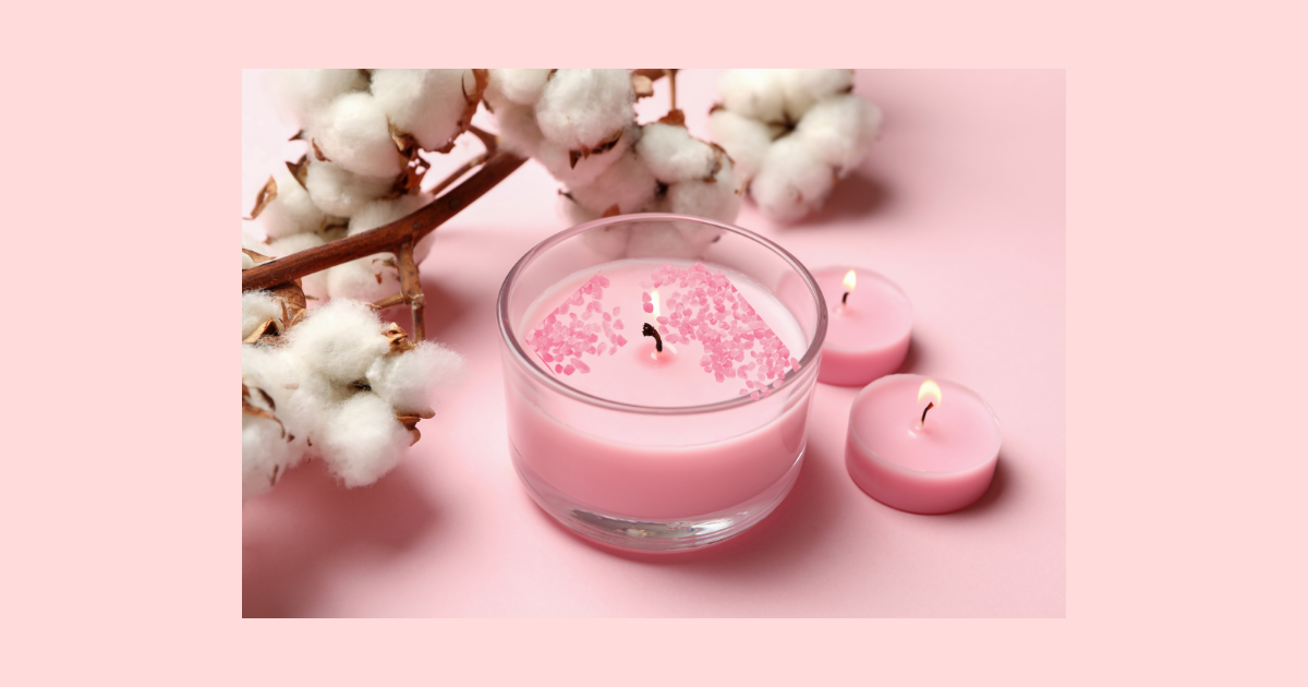 Rose candle with rose quartz healing crystals