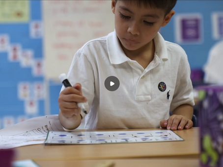 Kid working on assignment in classroom