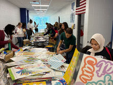 New DPS teachers collecting donations at new teacher orientation at Northern High School