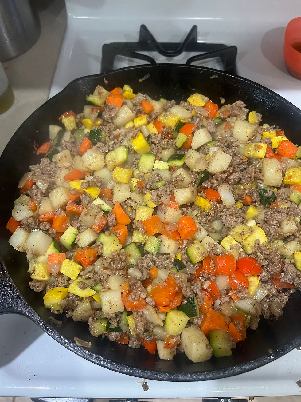 A skillet meal of ground beef, potatoes, and veggies