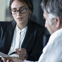 Divorce-Lawyer-Showing-Document-to-Client.jpeg