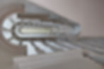 beautifully crafted bespoke staircase with intricate joinery, showcasing the company's high-quality craftsmanship