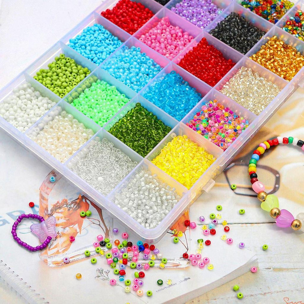 Open glass bead collection kit showing assorted glass beads organized by color and style.
