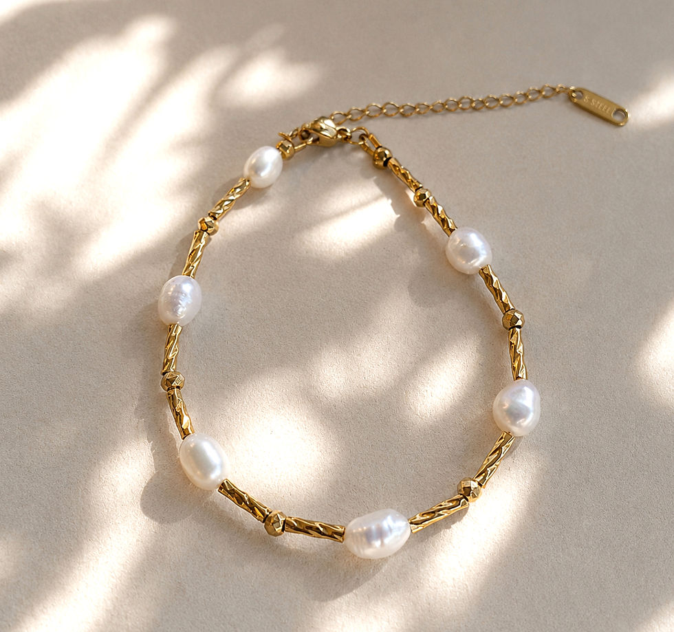 Tratto freshwater pearl bracelet flat lay, titanium steel bar links and extender chain on grey background