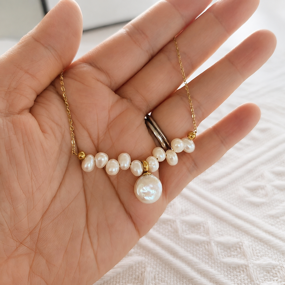 Coin pearl necklace with a single 11mm freshwater pearl pendant and delicate rice pearl chain