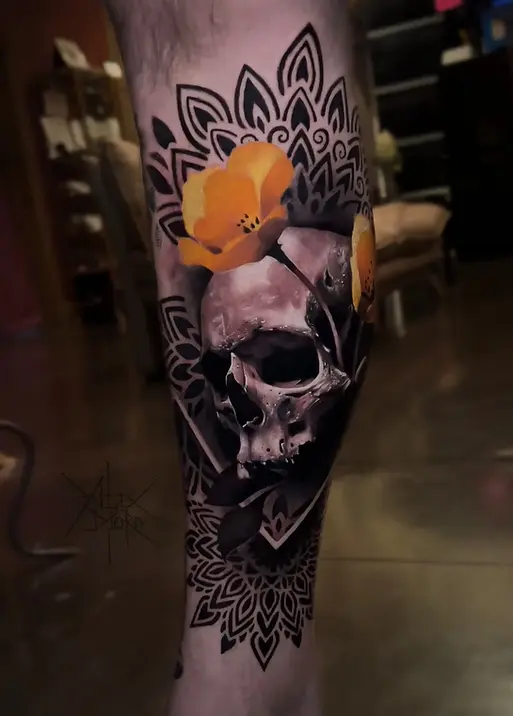 black and grey skull tattoo with mandala pattern and floral detail