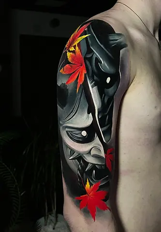 Color Japanese mask cover-up tattoo on shoulder by Alex Moro featuring bold contrast, saturated colors, and long-lasting structure in Orange County, California