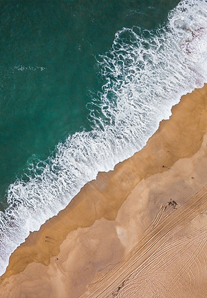 a bird's eye view of a beach and ocean_e