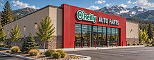 Commercial property maintenance at an O'Reilly Auto Parts store in Colorado with snow-capped Rocky Mountain peaks