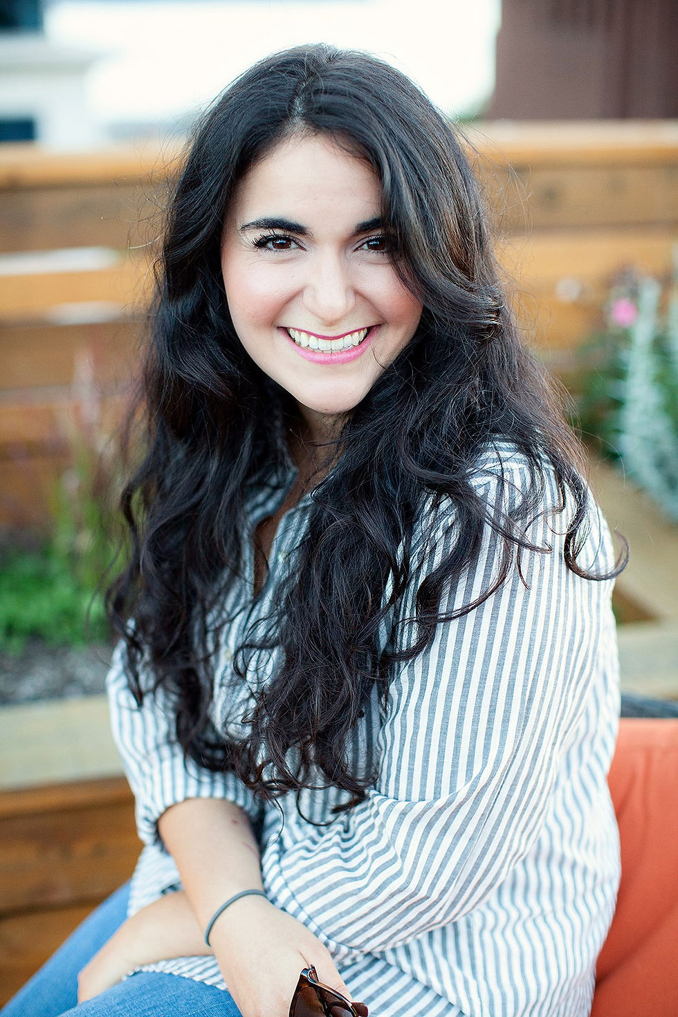 Smiling facialist with 20 years experience outdoors.