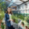 Woman Working in Greenhouse