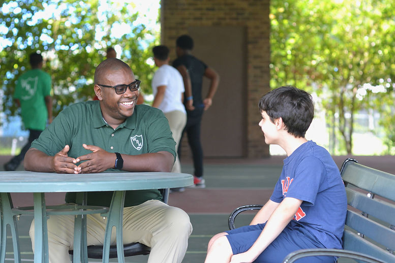Waldo Burton staff member talking to a resident