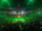 Packed arena, green lights, exciting basketball game