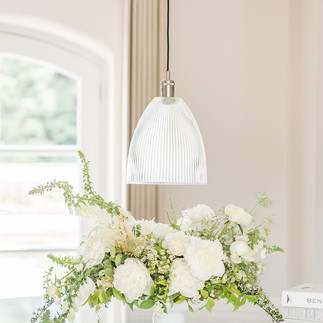 A spring and white and green flowers arranged by Jacqui O in a bowl