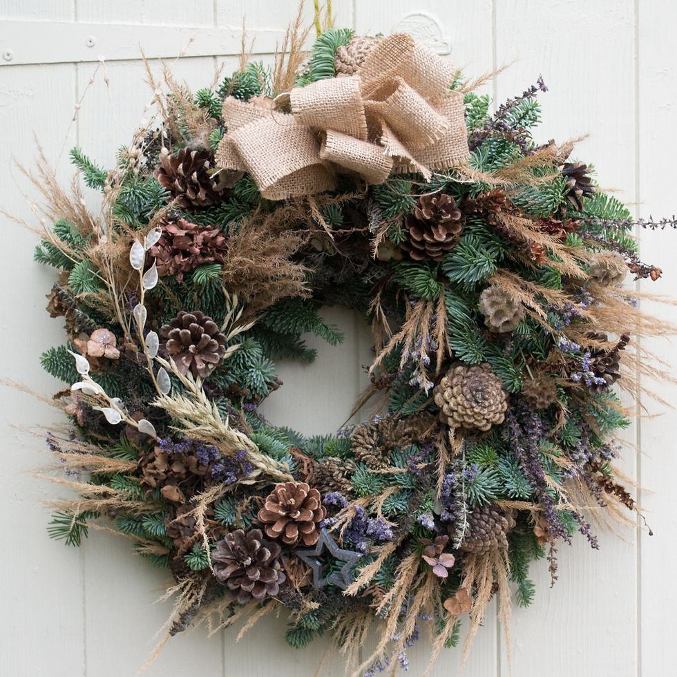 A wreath with a hessian bow dried lavender and grasses with fresh noblis fir designed by Jacqui O, Nantwich