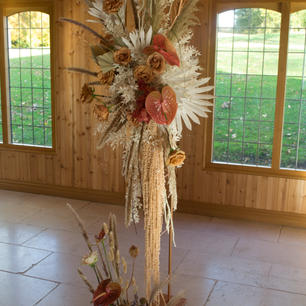 'Toffee' rose, 'Cognaca' anthurium and dried ruscus ceremony arch
Colshaw Hall