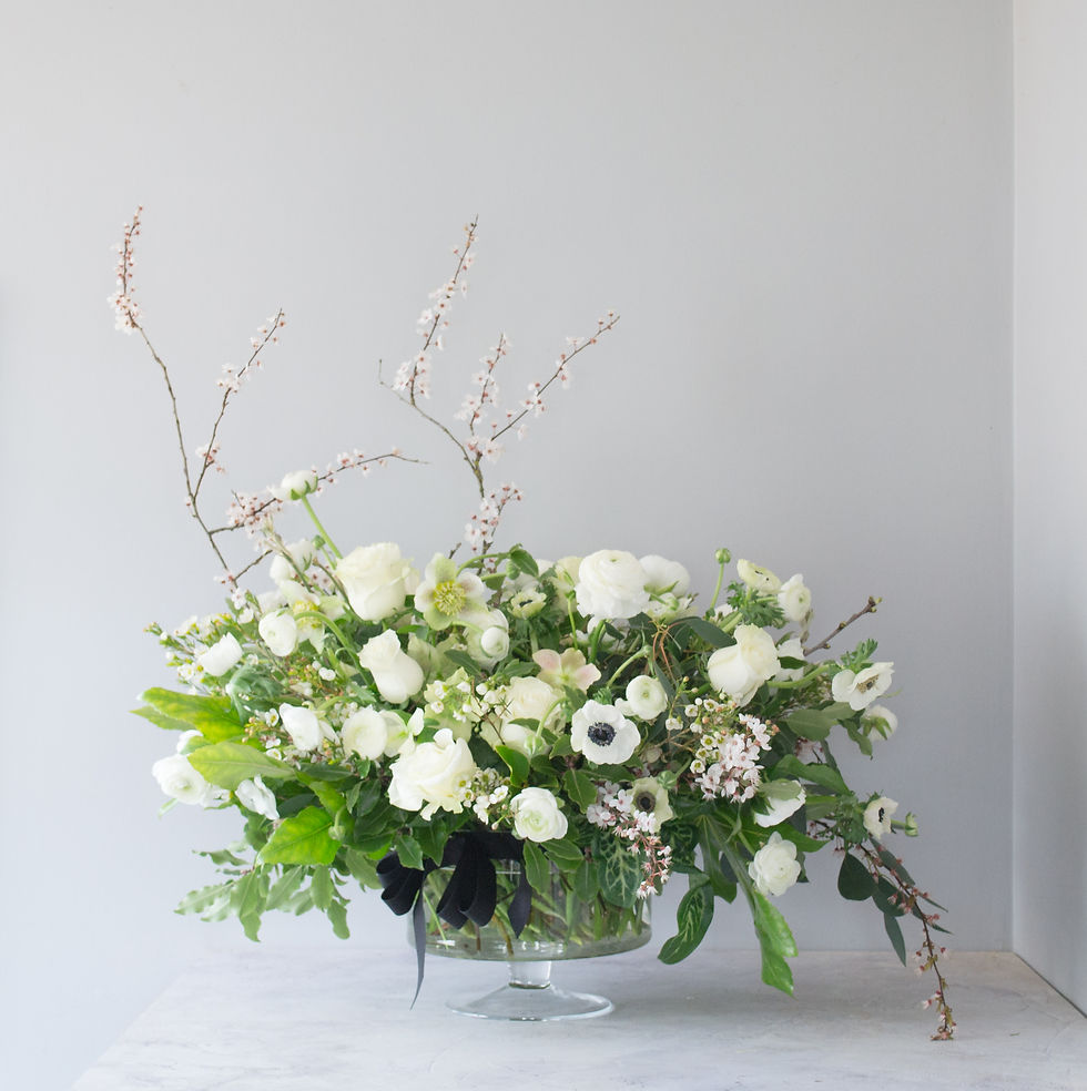 Thumbnail: Rose, anemone and ranunculus floral arrangement in footed bowl