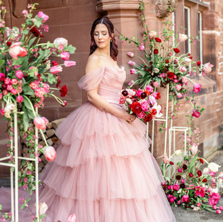 ranunculus, tulips, sweet William and ribes flowers surrounding bride