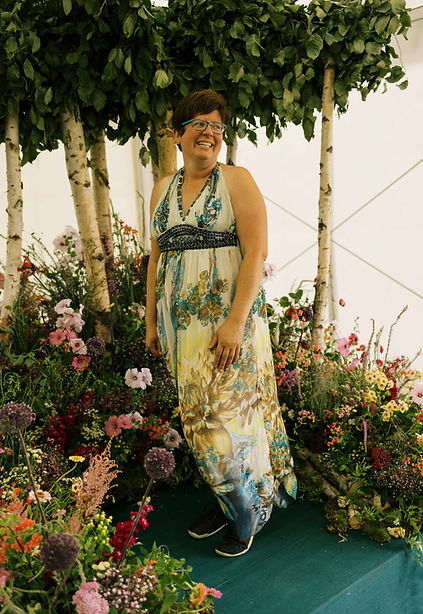 Jacqui O surounded by British Flowers