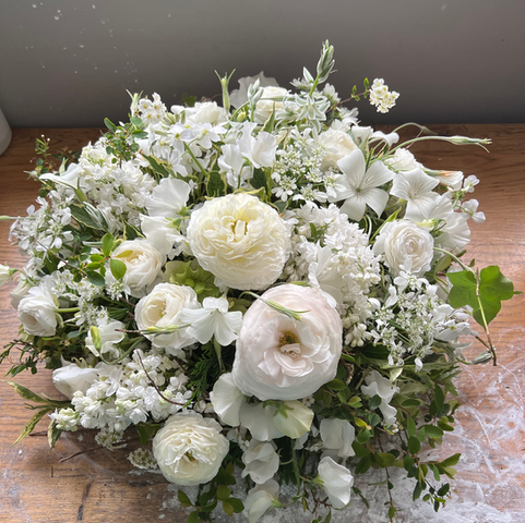 A small, English garden-inspired tribute for a grandad, featuring ranunculus, sweetpeas, corn cockle, ammi, and other locally grown flowers, arranged with care for a bee-friendly, heartfelt display.
