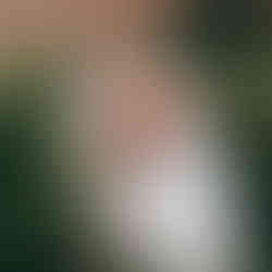 Bride and groom with her bouquet of dahlias, zinnia and sunflowers