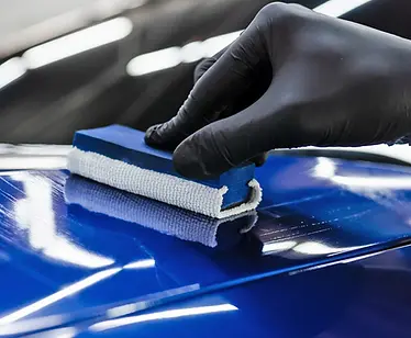 applying-ceramic-coating-to-a-blue-car.webp