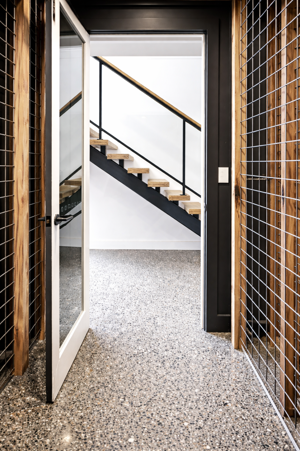 Industrial wine cellar with modern staircase