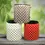 Thumbnail: Three RightPot air pruning pots in a creative stacked arrangement with Pearl White and Coral Red pots at the base and a Metallic Grey pot on top, showcasing color variety and durable, breathable design.