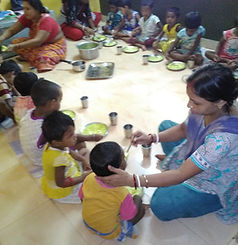 Children having warm cooked lunch at MCW