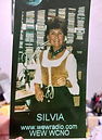 Silvia in radio studio. Text: wewradio.com, WEW WCNO