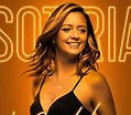 Smiling woman with 'SORRIA' text on orange background