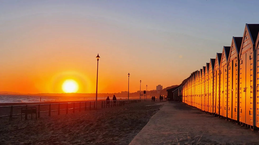 David Pickett's picture of the sunset on the seaside in Bournemouth in front of the beach huts