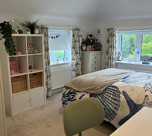 A calm and clutter free bedroom after being orgnanised by Declutterin Crew.