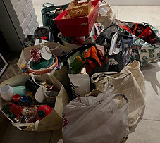 A collection of bags ready sorted to go to the charity shop to be recycled.