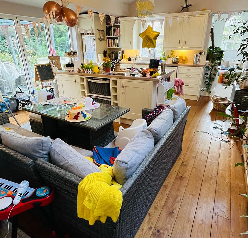 Open plan living area before beng decluttered by Decluttering Crew