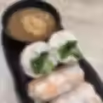 Vietnamese shrimp spring rolls with rice paper, fresh lettuce, and peanut dipping sauce