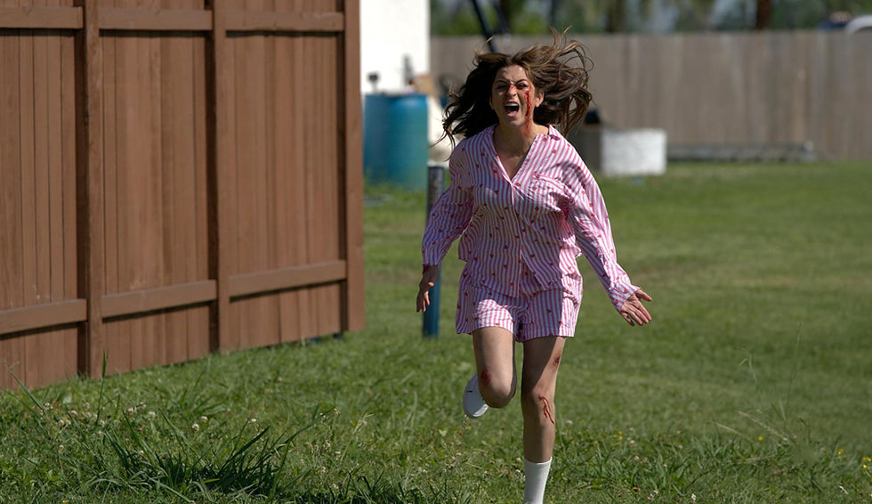 Girl covered in blood running