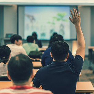 vecteezy_a-young-man-raises-his-hand-during-a-lecture-at-a-workshop_1103172.jpg