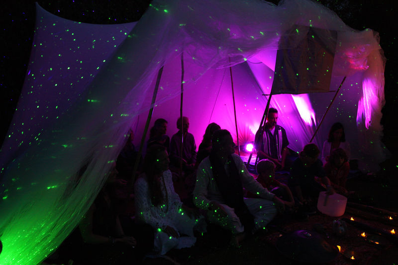 Night gathering lit with warm ambient light