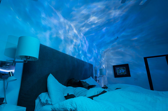 Bedroom bathed in soft galaxy light