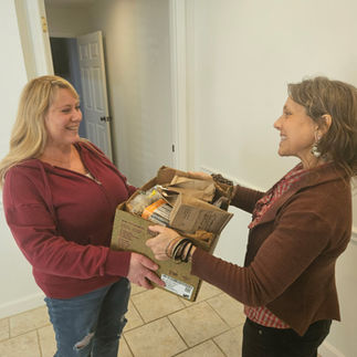 Giving a box of herbal donations to a East TN community in need