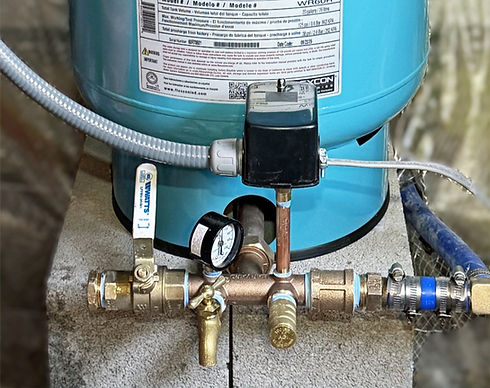 Residential well pump system with pressure tank and pressure switch