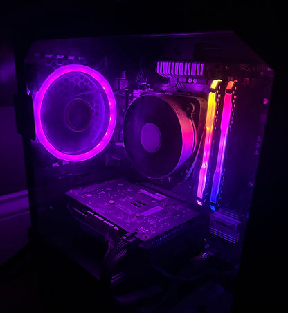 Rainbow lit PC with clear case showing internal parts.