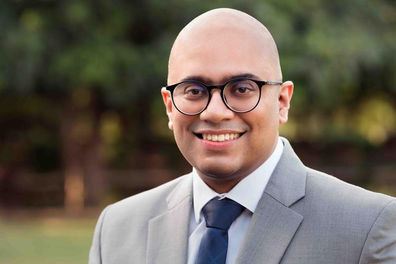 headshot of a lawyer ambient background shot by a professional photographer in Delhi NCR.