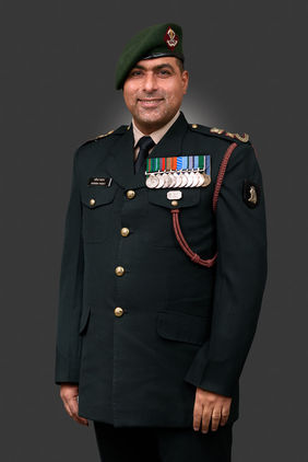 Portrait of an army officer with a clean backdrop shot by a professional photographer in Gurgaon, Delhi NCR.